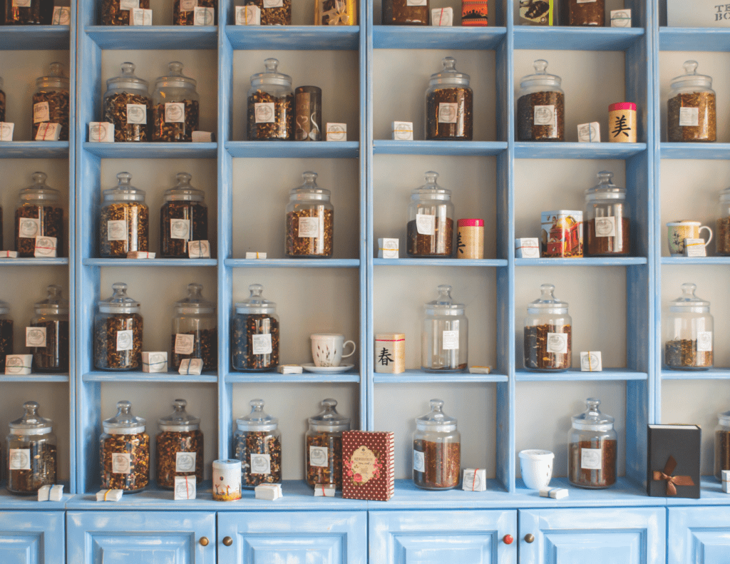 Dried herbs organized on blue shelf. 9 Reasons The Buhner Protocol is the BEST Treatment for Lyme Disease.